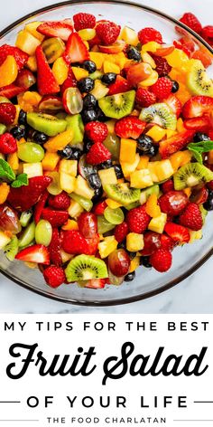 fruit salad in a glass bowl with the words my tips for the best fruit salad of your life