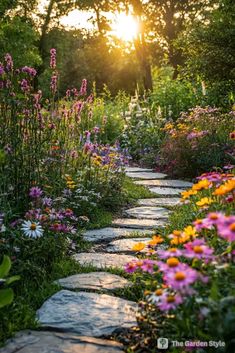 a stone path surrounded by wildflowers and other flowers in the sunlit garden