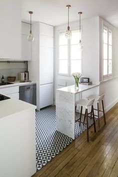 the kitchen is clean and ready to be used as a dining room or living area