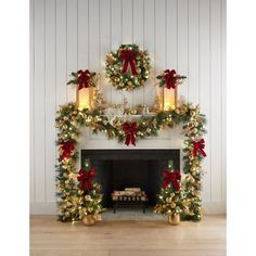 a fireplace decorated for christmas with wreaths and lights