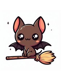 a cute little bat sitting on top of a broom