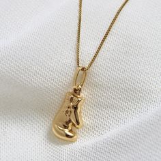 "14K Gold Boxing Glove Necklace, Real Gold Boxing Glove Necklace, Boxing Glove Pendant, 14k Gold Boxing Glove Charm Gift, For Fighters Him/Her. Can be worn with other necklaces, great for layers. A Perfect 14K Gold gift. . . . * Pendant measurement including the bail: (15x10 mm) * Chain: 1mm Box/ It can also be sold separately * Stamp: Real 14k Gold * Never gold filled or plated * Packaged With Free Gift Box . . . If you have any questions, just hit the \"Message the Seller\" button ( bottom rig Gold Boxing Gloves, Necklace Real Gold, Boxing Glove, Gold Gift, Boxing Gloves, Charm Gift, Charm Necklaces, Real Gold, Photography Art