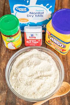 ingredients to make cake sitting on top of a wooden table