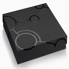 a black box with an abstract design on it