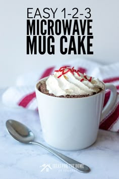 a mug with whipped cream and candy canes in it