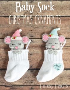 two baby sock christmas ornaments with mouses on them and the words, baby sock christmas ornaments