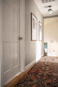 the hallway is clean and ready to be used as a place for pictures or other things