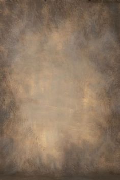 an abstract painting with gold and brown tones