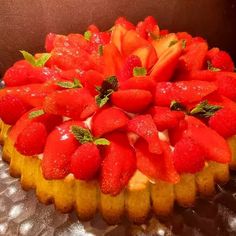 a cake that has strawberries on top of it