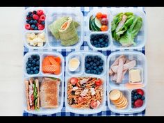 a plastic container filled with lots of different types of vegetables and fruits in it's compartments