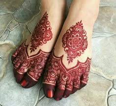 the feet are decorated with henna designs