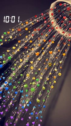 the shower head has many colorful beads on it