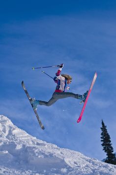 a person jumping in the air on skis