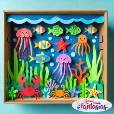 an ocean scene made out of cardboard with sea animals and fish on the bottom, under water