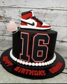 a black and red birthday cake with a pair of sneakers on top that says 16th birthday