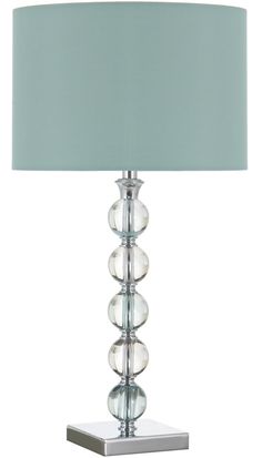 a glass lamp with a blue shade on it's base and a silver metal base