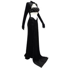 Introducing our handmade exquisite Crystal Velvet Formal Evening Gown, a masterpiece of elegance and style. This gown is designed for those who appreciate the finer things in life and want to make a statement at any formal occasion. With a regular sleeve style and waistline, the gown offers a comfortable and flattering fit for a range of body types. The high neckline adds a touch of sophistication, while the sweep train adds a graceful and dramatic flair as you move. Crafted from a luxurious blend of Velvet, Polyester, and Cotton, this gown ensures both comfort and quality. The woven fabric showcases the intricate craftsmanship that goes into creating this stunning piece. Its full-length silhouette and ball gown style create an aura of grandeur, perfect for a memorable entrance. The gown f Fitted Evening Gown With Long Train, Fitted Evening Gown With Sweep Train, Fitted Gown With Sweep Train For Evening, Fitted Prom Gown With Long Train, Fitted Gown With Long Train For Banquet, Fitted Gown With Long Train For Prom Season, Fitted Dress With Long Train For Banquet, Fitted Gown With Long Train For Prom, Formal Fitted Dress With Long Train