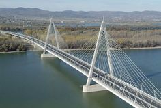 an aerial view of a bridge over water