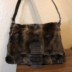 Fendi & Lizard Green Mink Fur Baguette Condition: Gently Used Soft Dark Green And Brown Mink Fur Exterior Trimmed With Green Lizard Leather Handle And Front Ff. Silver Hardware Through Out Beige Leather Interior With One Sided Zippered Pocket No Stains Or Smells I’m Really Clean With My Bags Very Rare Baguette Designer Brown Baguette Bag, Brown Baguette Bag For Evening, Brown Baguette Evening Bag, Designer Brown Baguette Bag For Evening, Louis Vuitton Planner, Fendi Fur, Fendi Tote Bag, Fendi Baguette Bag, Green Lizard