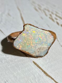 Beautiful electroformed Raw Australian opal ring using recycled copper Vibrant, twinkling full of red + multi coloured fire with a section of natural sandstone on the opal face A genuine natural opal (not a doublet, triplet, inlay or synthetic opal) Stone size: 17.7 x 13.8 mm   Direct from an opal mining family :) Size: 5 1/2 US The one you see is the one you will receive Thanks for looking! Caring for electroformed jewellery: Due to the nature of its creation electroformed jewellery is not as r Luxury Ethical Open Opal Ring, Luxury Unique Polished Opal Ring, Gold Adjustable Opal Ring, Round Shape, Raw Opal Rock, Raw Opal Ring, Australian Opal Ring, Raw Opal, Ring Opal, Electroformed Jewelry