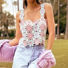 Give Your New Season Wardrobe The Upgrade It Deserves With This Multi Floral Crochet Crop Top. This Crop Top Is Brought To You In A Multi Floral Crochet Material With A Cropped Length, How Could You Resist This? This Crop Top Is Calling Your Name Doll. Just Add Denim Jeans, Sandals And Accessories To Complete The Look. Length Approx 33cm/13" (Based On A Sample Size Uk 8) Model Wears Size Uk 8/ Eu 36/ Aus 8/ Us 4 Model Height - 5ft 9.5" Length May Vary Due To Crochet Knit Print May Vary Spring/summer Lace Crop Top, Spring Crochet Top For Day Out, Spring Fitted Crochet Top For Day Out, Spring And Summer Lace Crochet Top, Pink Sleeveless Crochet Top For Summer, Sleeveless Pink Crochet Top For Summer, Chic Pink Tops With Crochet Trim, Pink Fitted Crochet Top For Summer, Feminine Crochet Top For Beach In Spring