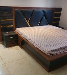 a bed that is made up with some drawers