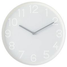 a white clock with numbers on the face is shown in front of a white background