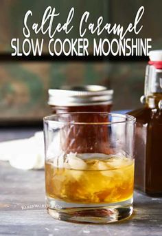 salted caramel slow cooker moonshine in a glass with ice and syrup