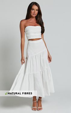 Stand out this summer in the Schiffer Two Piece Set - Strapless Top And Tiered Midi Skirt In White. This stylish co-ord set features a strapless top and a tiered midi skirt, perfect for those casual yet chic days. Made from cotton, this set is not only trendy but also comfortable to wear all day long. Whether you're heading to brunch with friends or exploring new city streets, this white two piece set will keep you looking effortlessly cool. So why wait? Add this must-have co-ord skirts set to y White Two Piece Skirt Set, Summer Co Ord Sets, White Set Outfit, One Set Outfit, White Skirt And Top, White Beach Outfit, Bridal Vibes, Blue And White Outfits, 2nd Choice