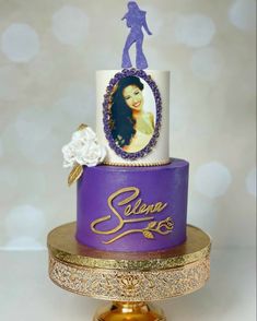 a purple and gold cake with an image of a woman on top