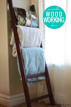 a ladder leaning up against a wall with towels on it and the words wood working above it