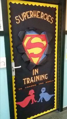 a door decorated to look like a superman training center with the words, superheroes in training