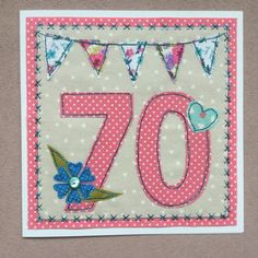 a birthday card with the number seventy and bunting flags on it's side