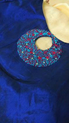 the fabric is blue with red, white and blue sprinkles on it