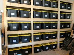 shelves filled with black and yellow plastic bins