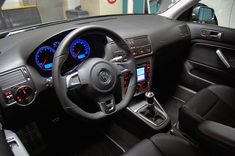 the interior of a car with dashboard lights and gauges