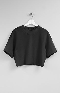 Color: BlackFabric: 65% Rayon, 30% Nylon, 5% SpandexCare: Machine Wash Cold/ Tumble Dry Low Raw-edge dense jersey tee. 18.5' (47cm) long. Made in USA. Crop Tees For Women, Tee Shirt Oversize, Cropped Tees, Oversized Crop Top, Trendy Shirt Designs, Black Shirts, Fashion Top Outfits, Crop Top Casual, Black Crop Top