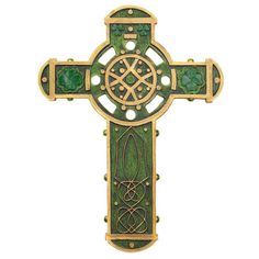 a green cross with an intricate design on it