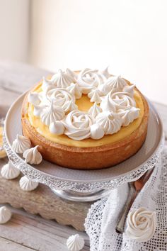 a cake with white frosting on a plate