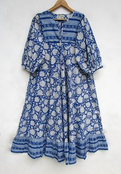 "ITEM DESCRIPTION blue dye printed long umbrella maxi dress - Henley neckline with cotton ties maxi dress - 3/4th sleeve with button maxi dress Features: 3/4th sleeve, Henley neck, Long dress Material: Cotton cambric Fabric: 100% cotton soft light weight ethnic print fabrics  Sleeve Length = 18 inch For more sizes & their measurement, please refer our below chart to understand the sizes variations available with us For your size requirement, please mention your size in seller note at the time of buying. SIZE MEASUREMENT  BUSTLENGTHSHOULDER XXS34 inch51 inch13.5 inch XS36 inch51 inch14 inch S38 inch51 inch14.5 inch M40 inch51 inch15 inch L42 inch51 inch16 inch XL44 inch51 inch16.5 inch 2XL46 inch51 inch17 inch 3XL48 inch51 inch18 inch   Company Return Policy:  Please write for more informat Blue 3/4 Sleeve Maxi Dress For Beach, Blue Cotton Maxi Dress, Indigo Bohemian Maxi Dress, Bohemian Blue Cotton Midi Dress, Blue Maxi Dress With 3/4 Sleeve For Summer, Summer Blue Maxi Dress With 3/4 Sleeves, Blue Block Print Midi Dress For Summer, Summer Batik Print Long Sleeve Maxi Dress, Blue Cotton Floor-length Maxi Dress