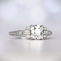 an old cut diamond ring with baguettes and side stones