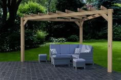 an outdoor seating area in the middle of a yard with a pergolan style gazebo