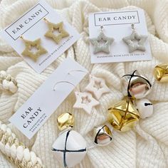 the ear candy is on display next to its packaging and other accessories, including star shaped candies