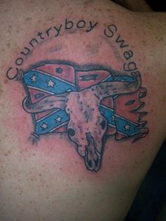 the back of a man's shoulder with an american flag and cow skull on it