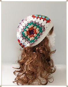 a crocheted hat is shown on top of a mannequin's head