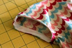 a piece of fabric sitting on top of a cutting board