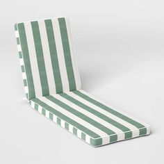 a green and white striped chair cushion on a white background with no people around it