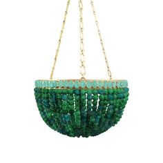 a green beaded purse hanging from a chain