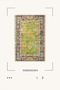 a green rug with an ornate design on the middle and bottom, in different colors