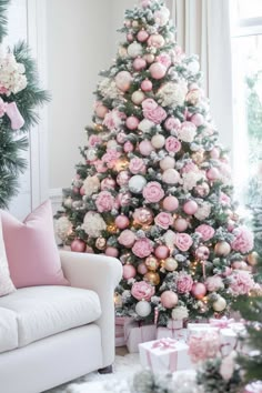 a decorated christmas tree with pink and white ornaments